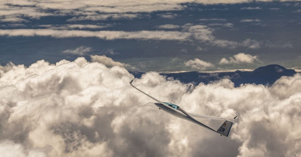 glider climbing and clouds in the back