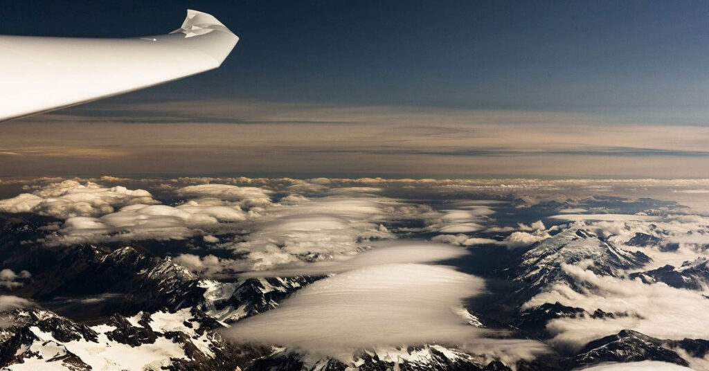 glider left wing and mountains in background